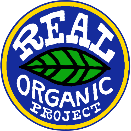 Logo for Real Organic Project: blue and yellow circular design with white text and a green leaf, promoting organic practices.