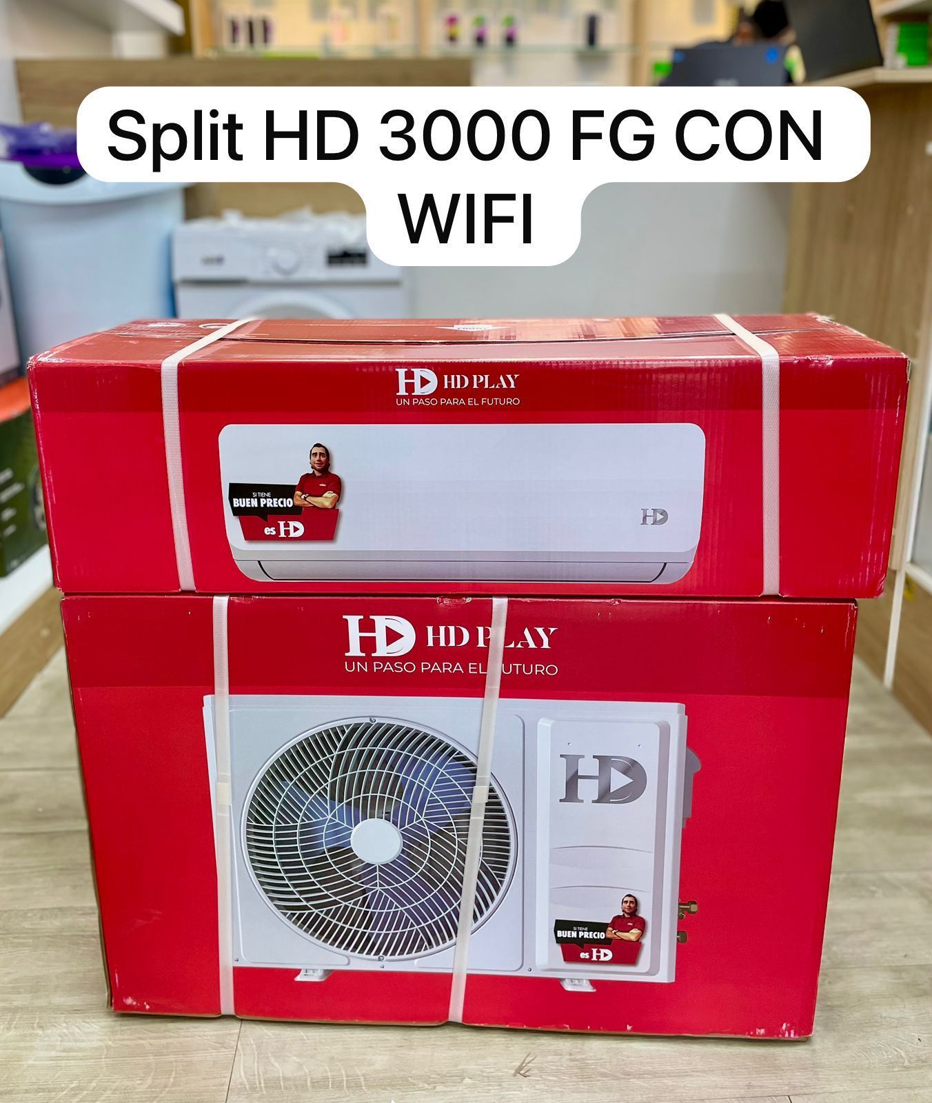 Conjunto de aire acondicionado split inverter HD rojo, en caja, con las unidades interior y exterior indicadas en el embalaje.