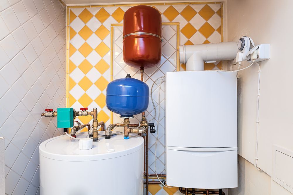 Water Heater and Heating System in a Utility Room — Zac Rennick Plumbing in Gilgandra, NSW