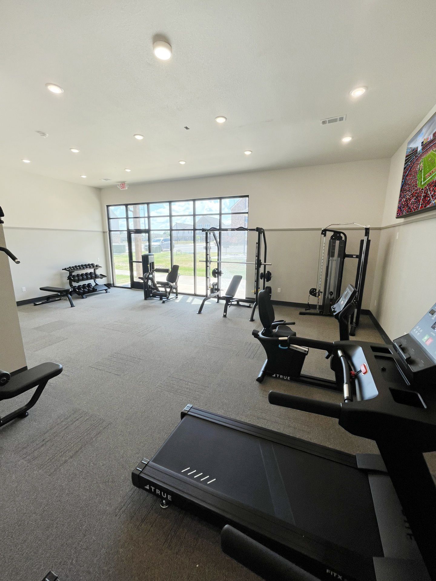 There is a treadmill in the middle of the room.