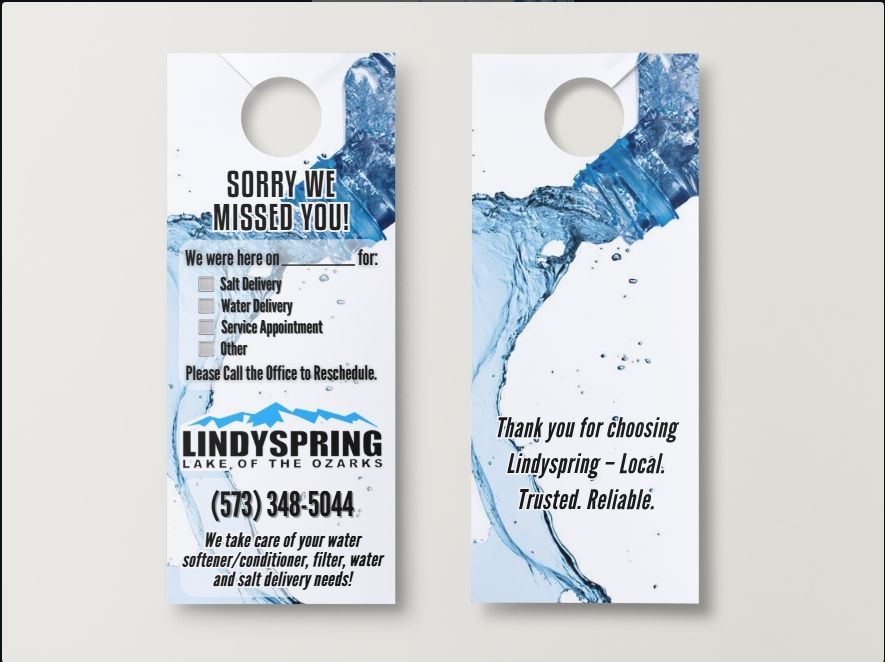 Two white Lindyspring door hangers with blue water graphics, featuring contact info and service checkboxes.
