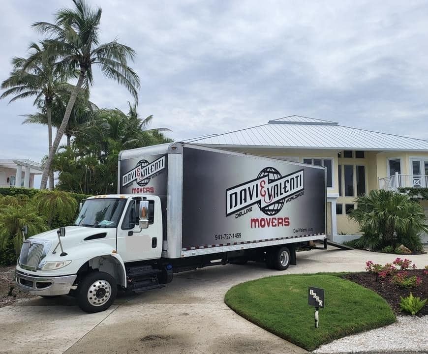 Moving truck parked in front of a house. 