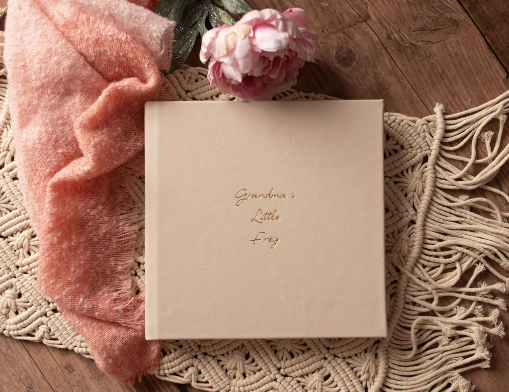 Beige photo album with gold text 