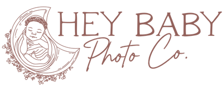 Logo for Hey Baby Photo Co. with sleeping baby illustration inside a crescent, with text in a brown color.