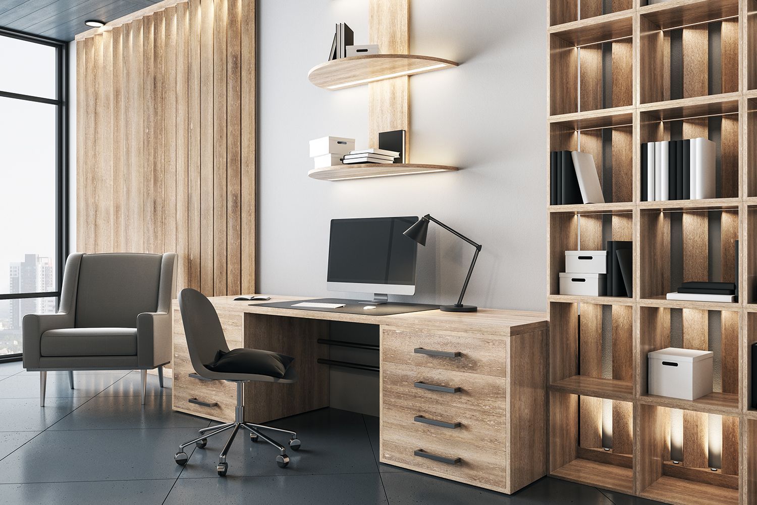 Wooden home office with desk, chair, shelves, and armchair by a window.