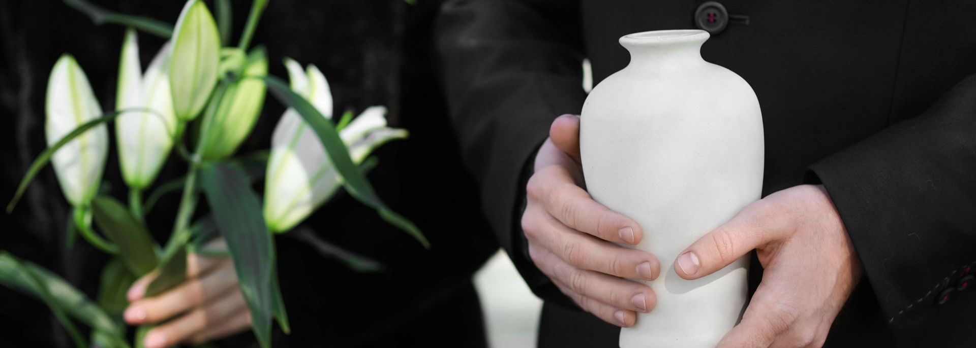 man holding urn