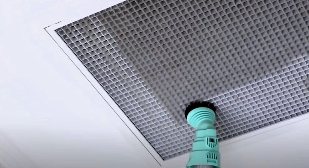 Expert brushing dirty air filter for clean indoor air