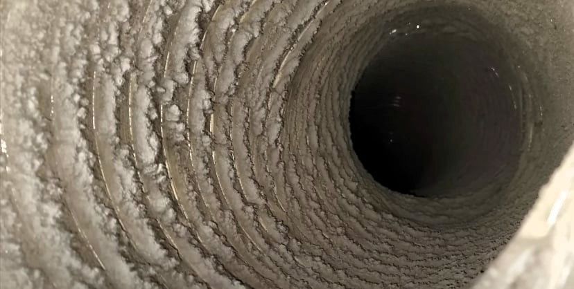 Close-up photo of a dusty HVAC air duct 