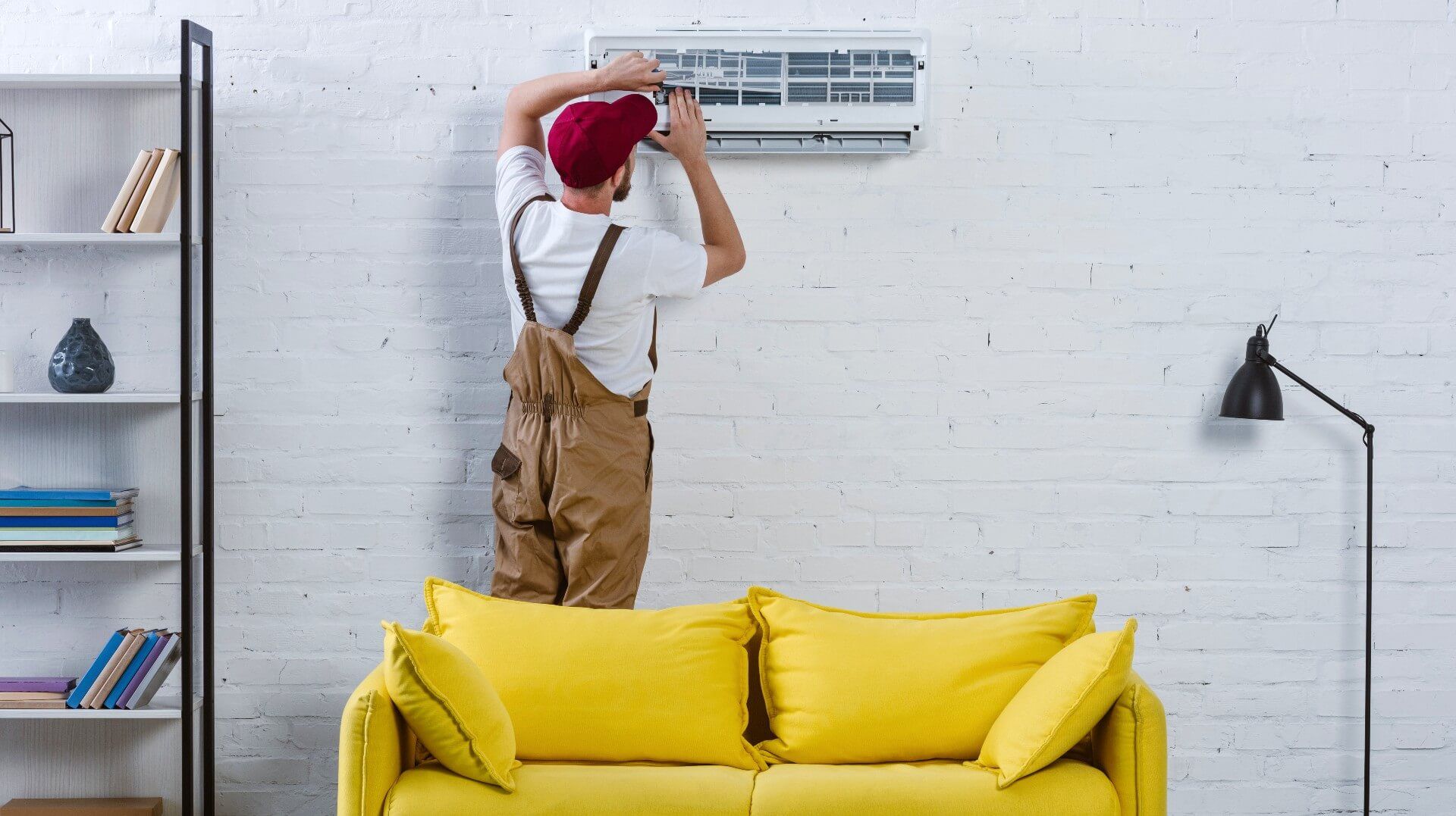 HVAC repairman doing air duct cleaning in a home prepared for such an occasion