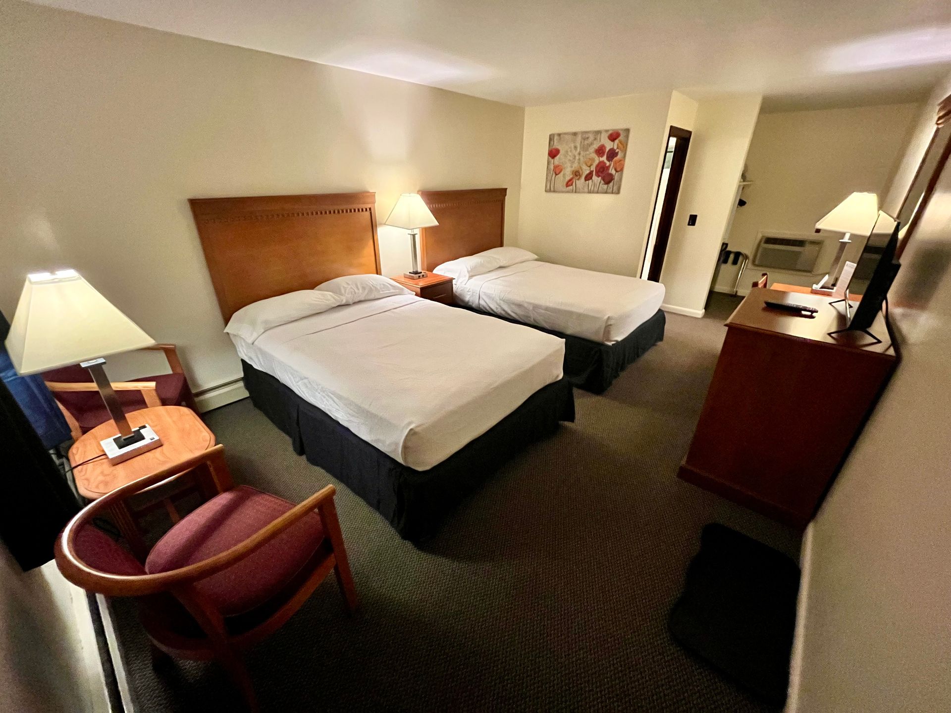 Room with two full sized beds