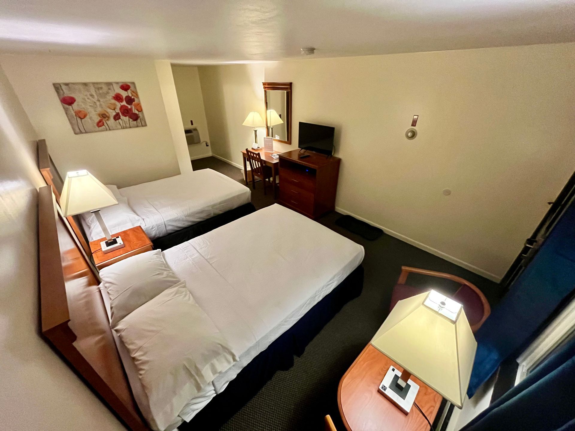 Room with two full sized beds