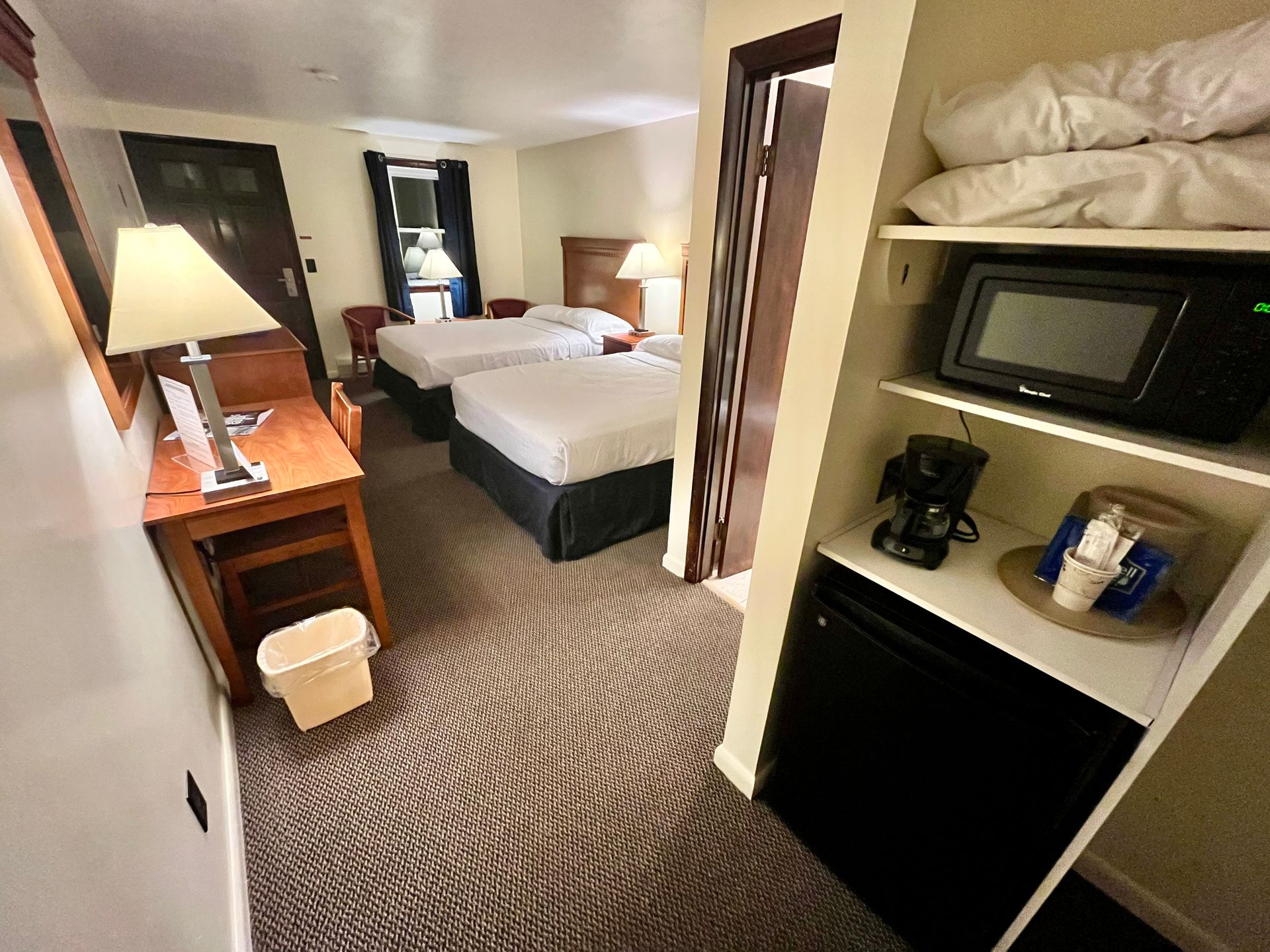 Room with two full sized beds