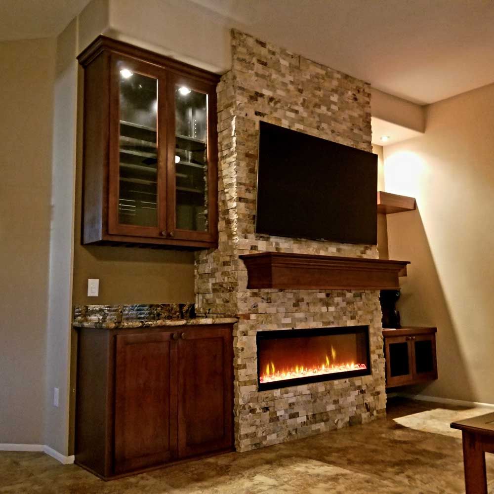 A living room with a fireplace and a flat screen tv