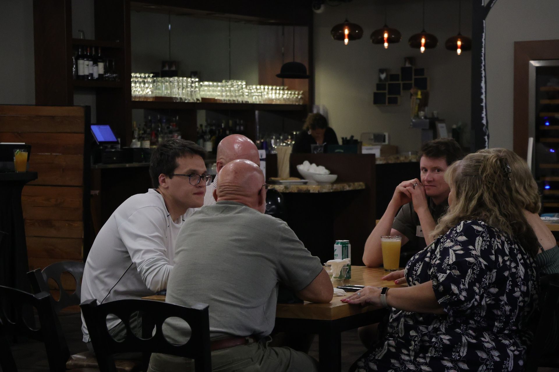 Folks learning more about relocating to Vermont's NEK share dinner and drinks with locals at Burke Mountain Hotel's Willoughby Room. 