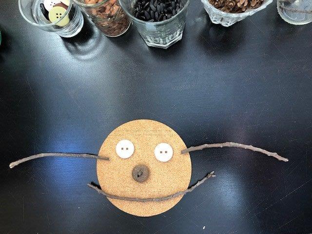 A piece of wood with buttons on it is sitting on a table.