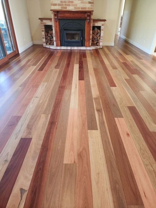 Room with a Fireplace and Polished Wooden Floor
— Kyall Chalker Floor Sanding & Polishing In Bungalow, NSW