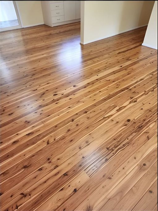 A Wooden Floor In A Room With A White Wall — Kyall Chalker Floor Sanding & Polishing In North Haven, NSW