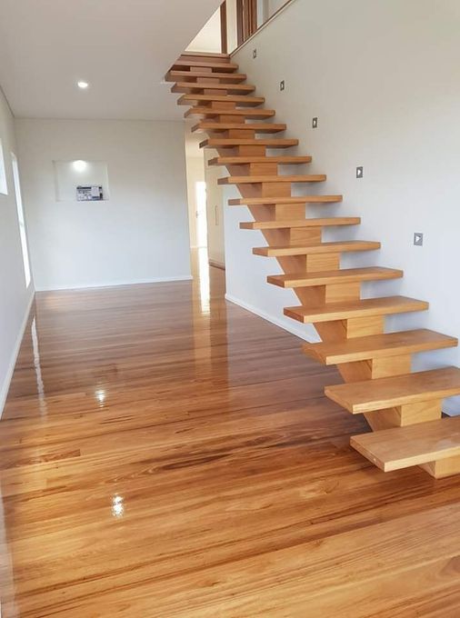 A Clean Wooden Floor with Wooden Staircase — Kyall Chalker Floor Sanding & Polishing In North Haven, NSW