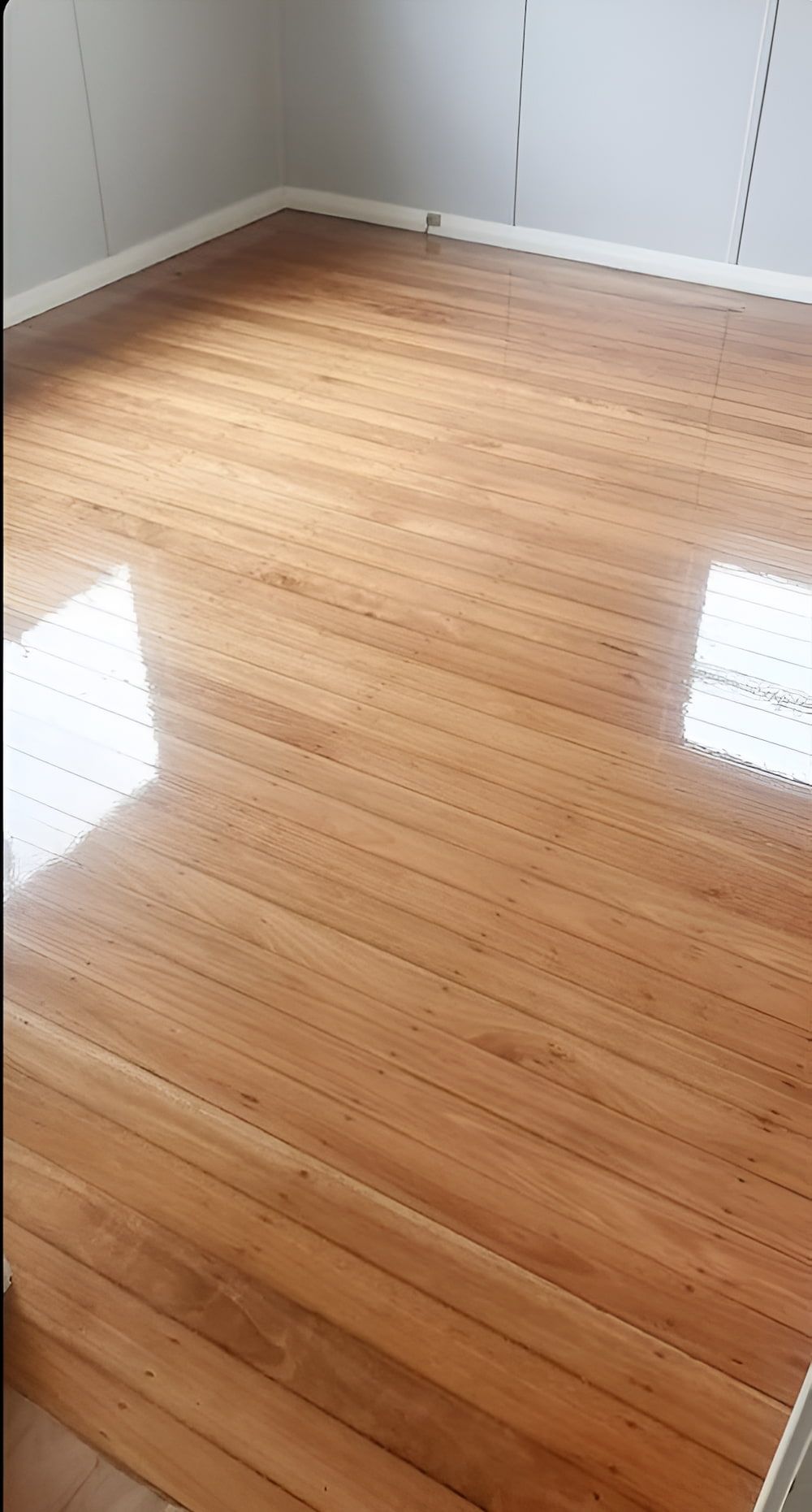 A Room With A Wooden Floor And A Window — Kyall Chalker Floor Sanding & Polishing In North Haven, NSW
