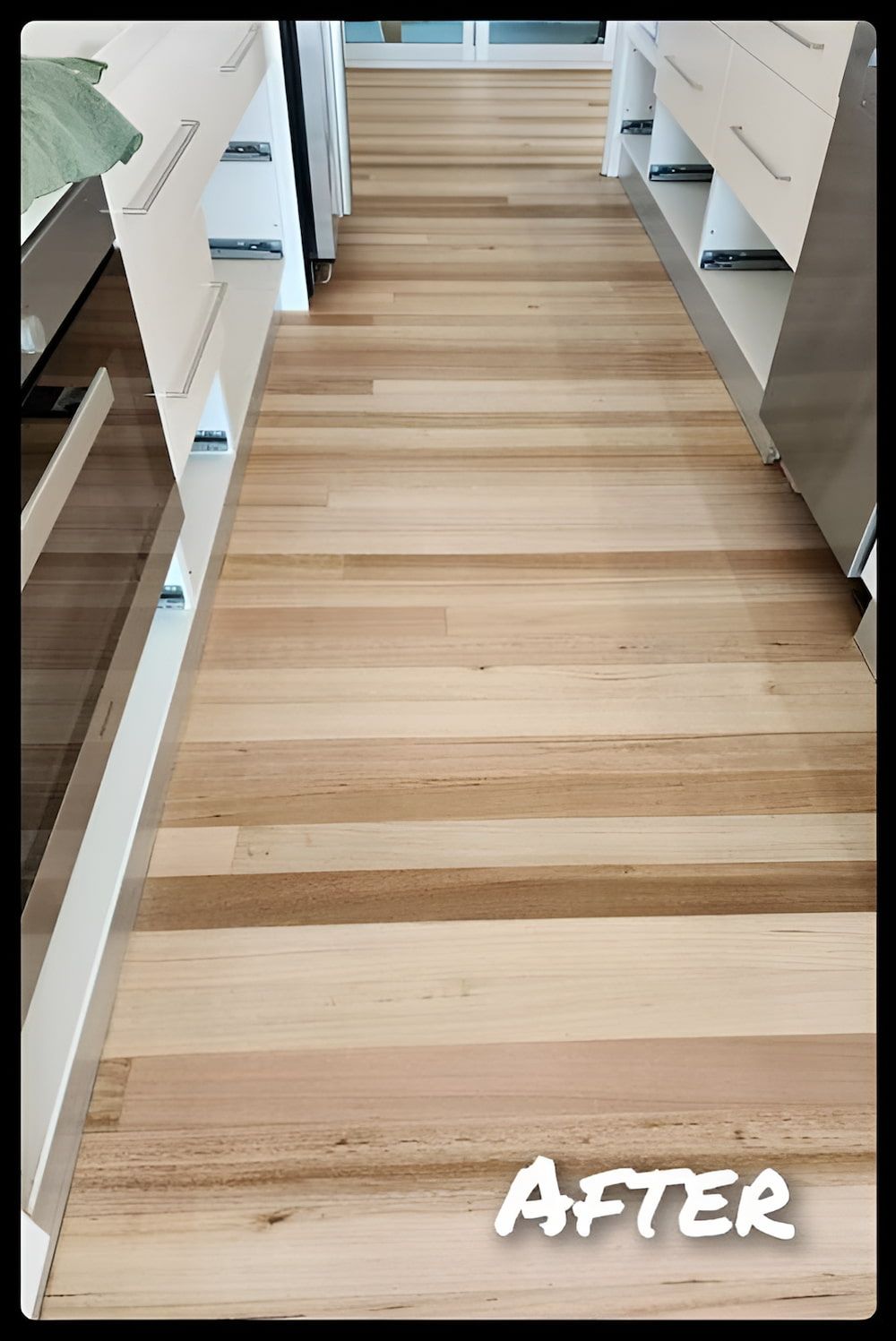 A Picture Of A Wooden Floor In A Kitchen After Being Cleaned — Kyall Chalker Floor Sanding & Polishing In North Haven, NSW