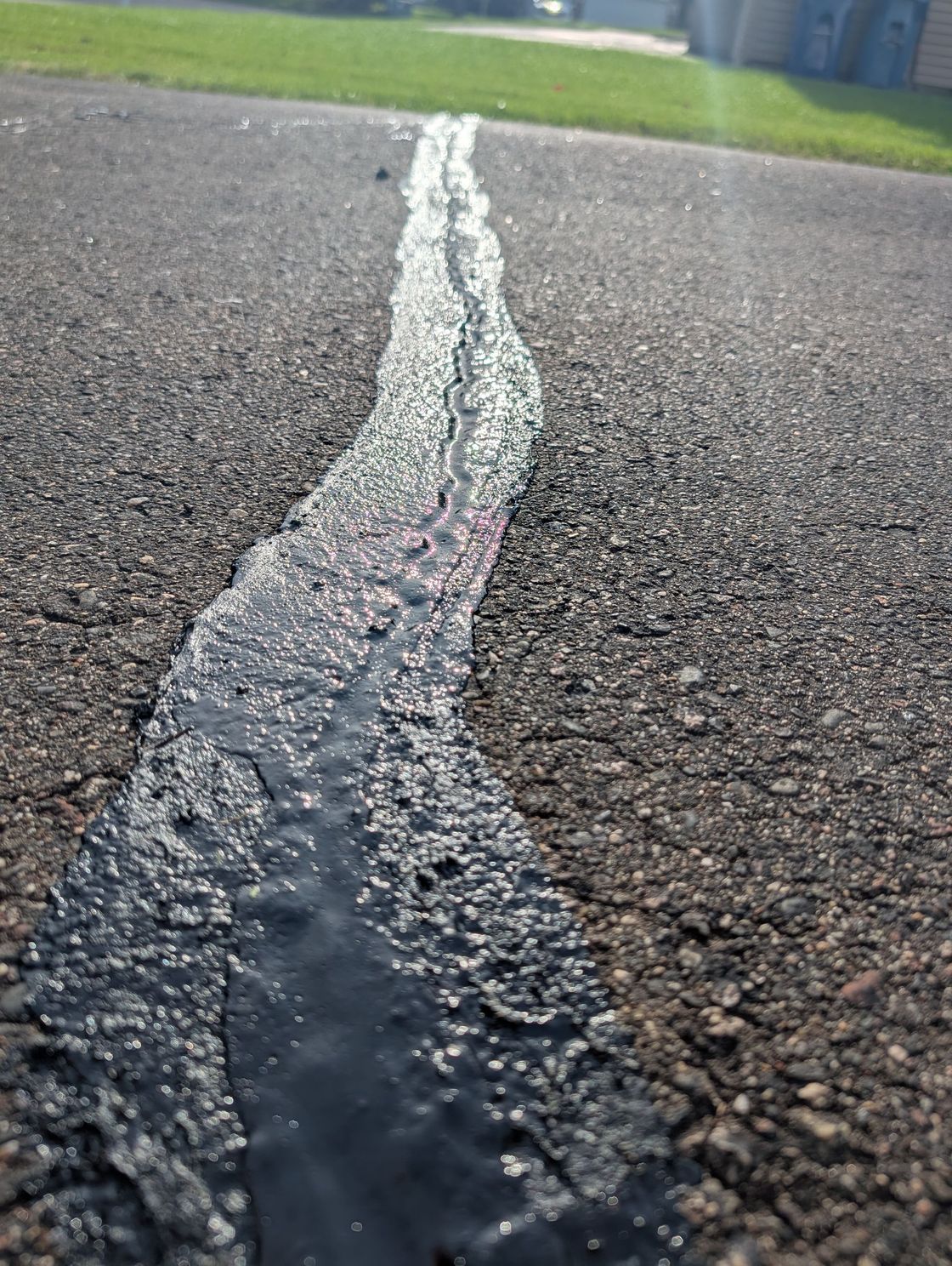 Hot rubber crack sealing
