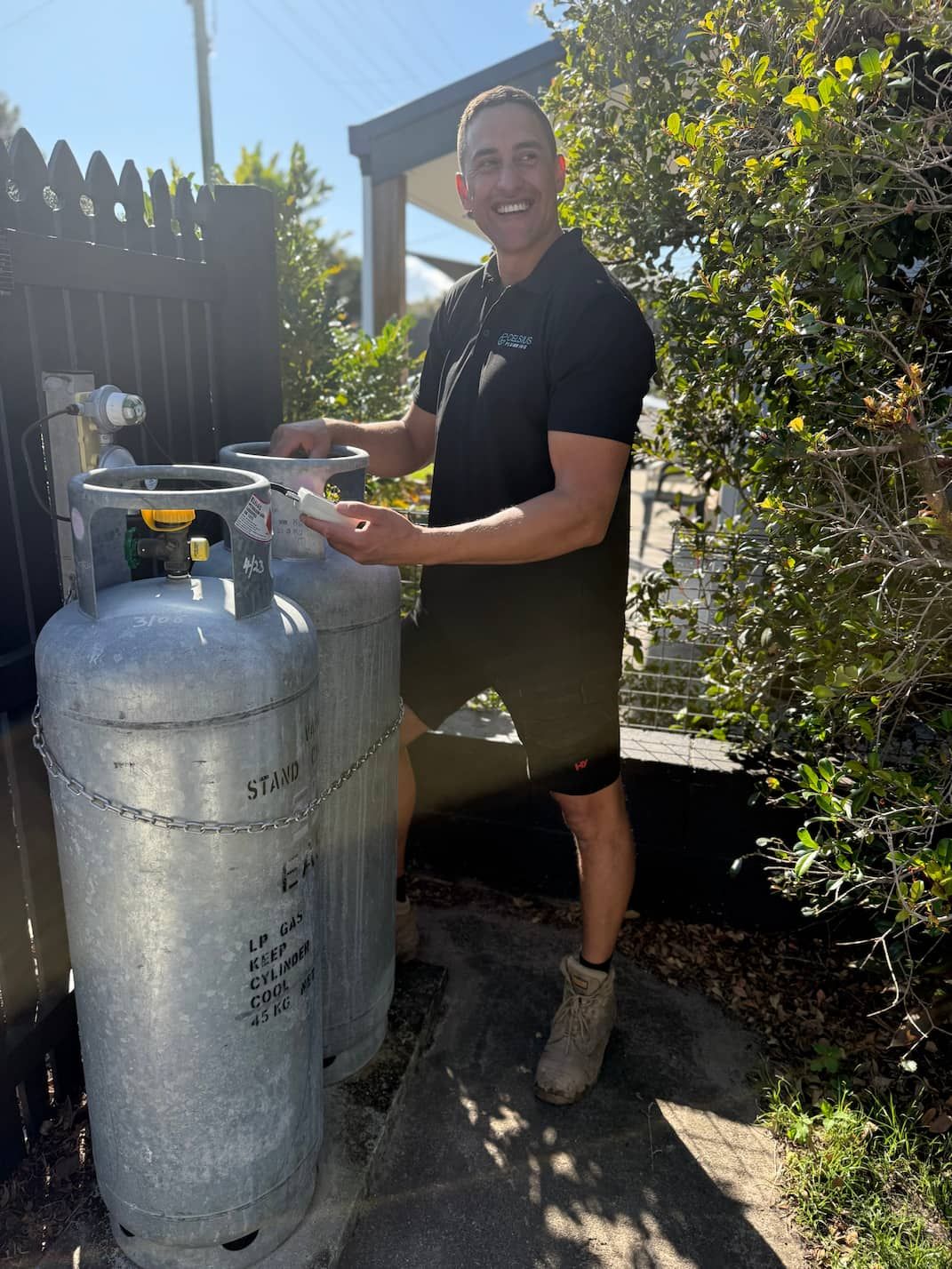 A person testing a gas bottle