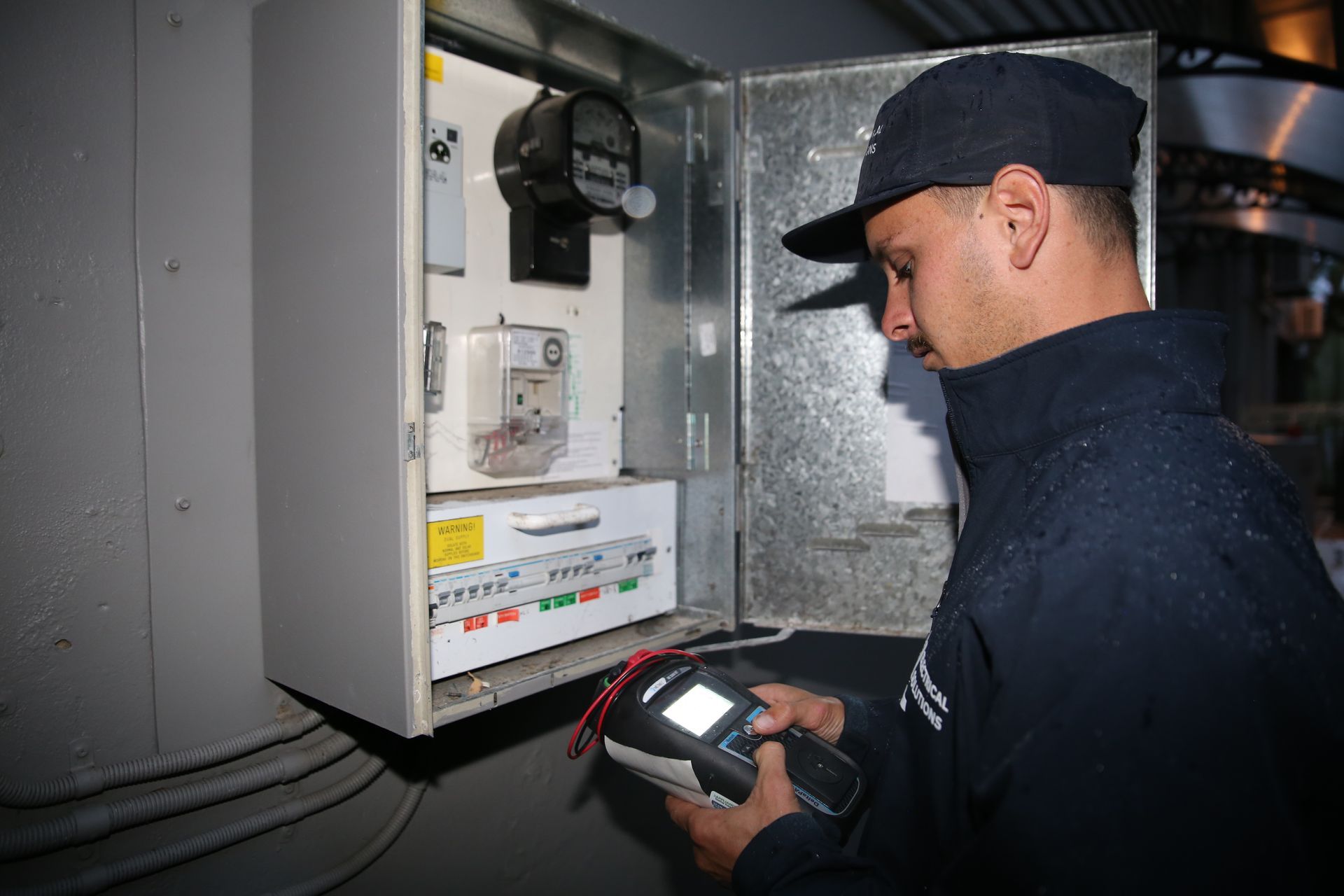 Josh from JL Electrical Solutions testing a switchboard