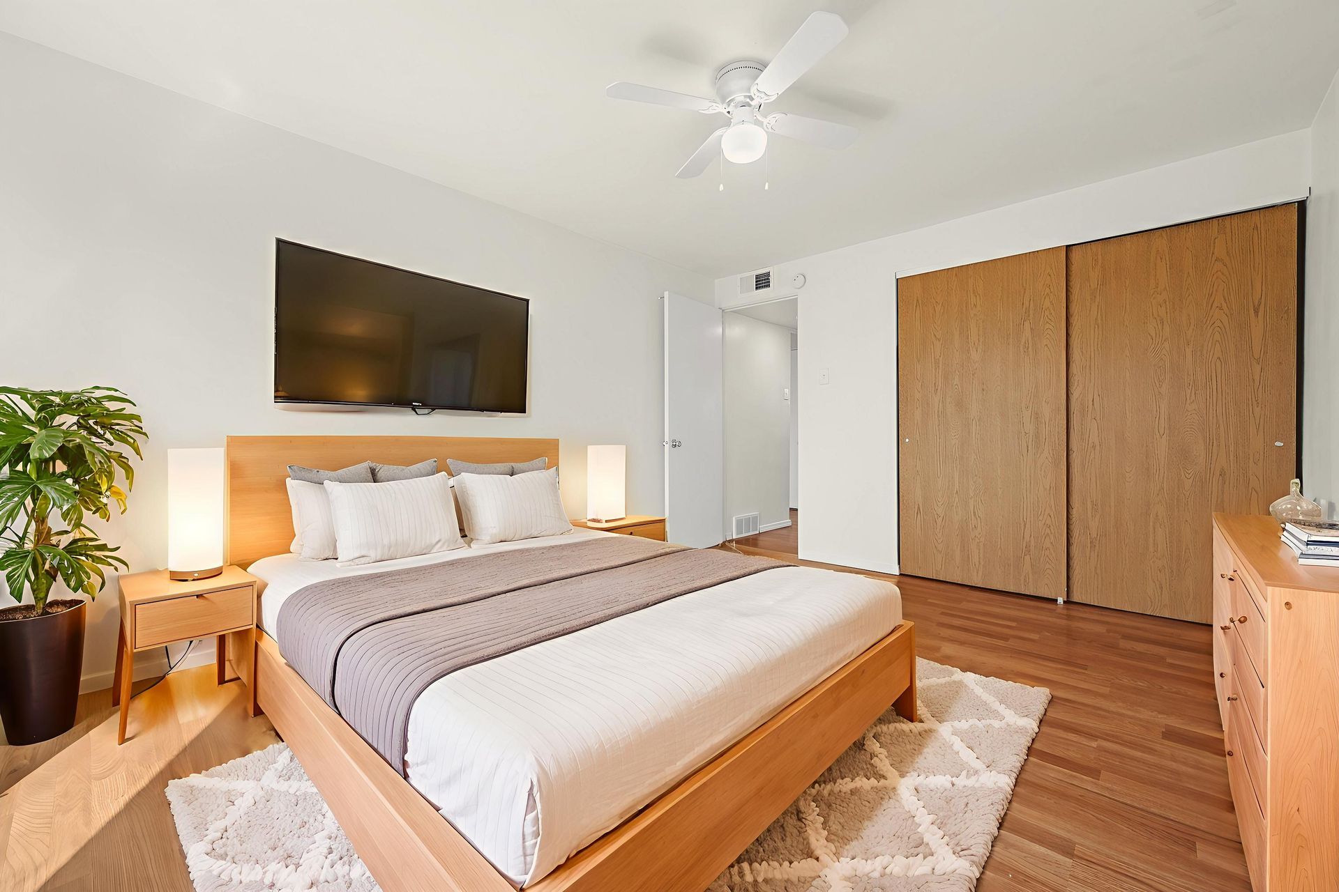 Bedroom with full bed and sliding closet