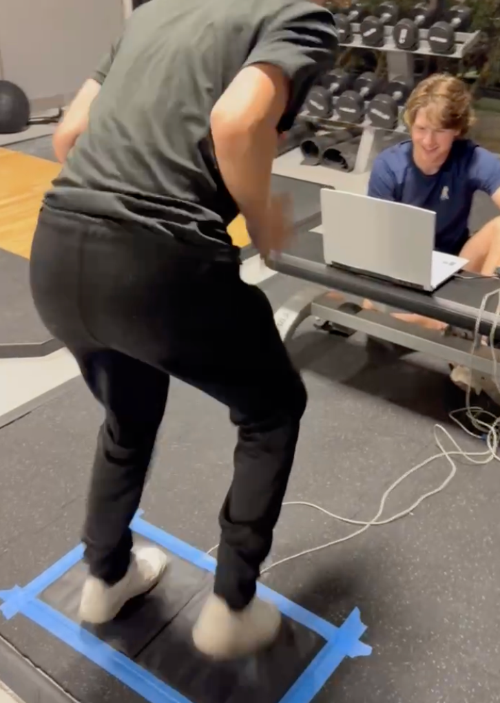 youth athlete performing a fitness diagnostic with coach