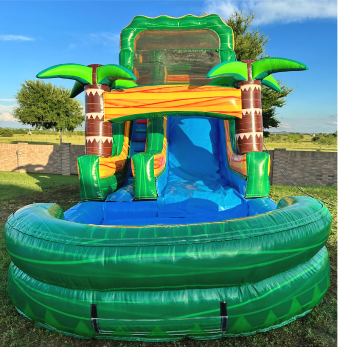 A large inflatable water slide with palm trees.