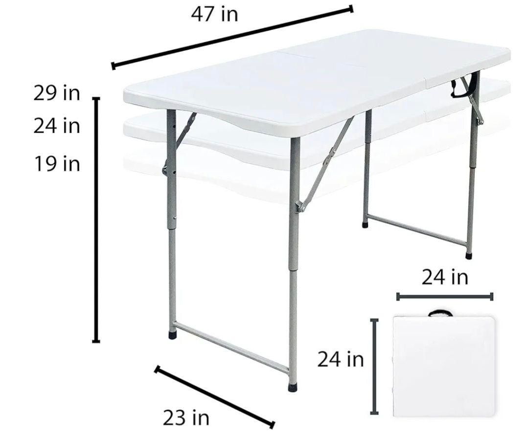 A table with four blue chairs on it