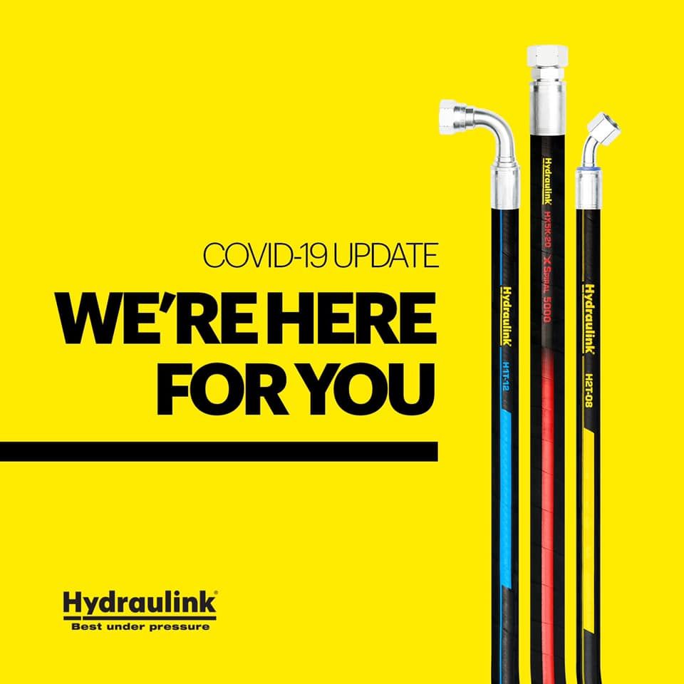 COVID-19 update poster with yellow background, black text “We’re here for you,” and Hydralink tubes on the right