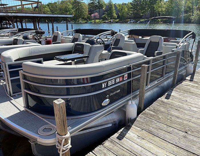 Black Barletta tritoon tied to the dock.