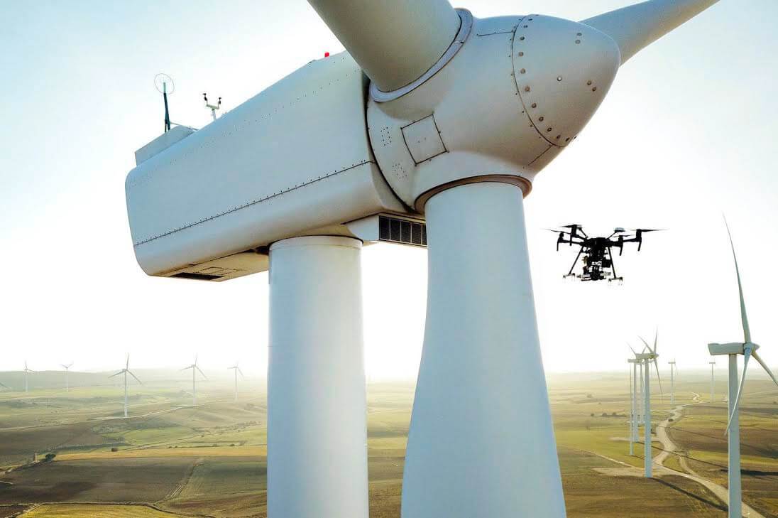 lone star drone at work near windmill