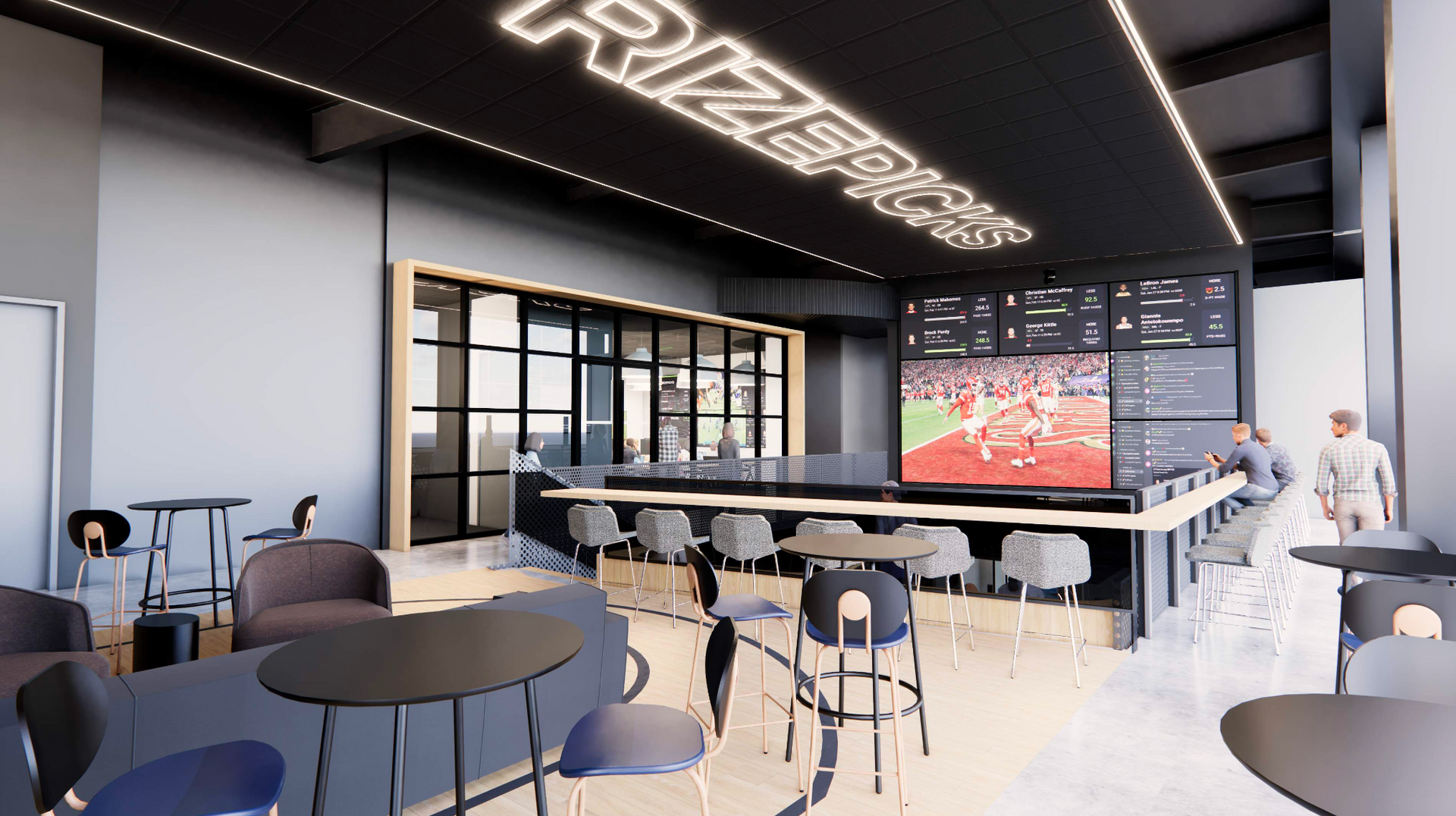 Interior of a sports bar with seating, TV screens, and a bar area with patrons. Black, gray, and blue decor.