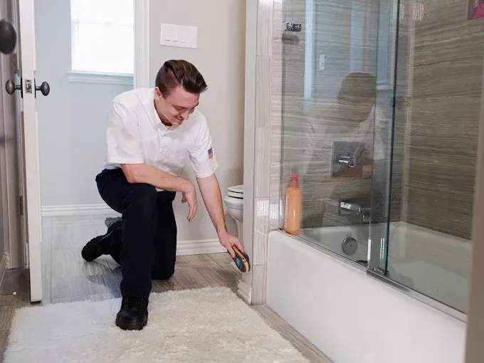 person removing water on the second floor of a home