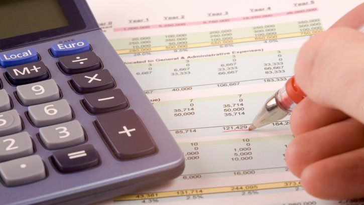 Calculator and Accountancy Paperwork — Russellville, AR — John W. Stottman Jr. CPA, PA.