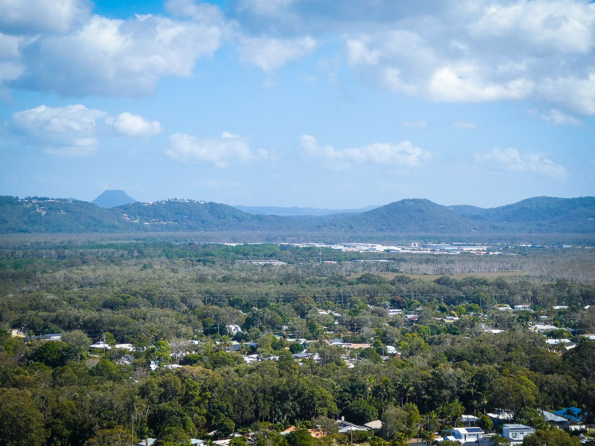 Overhead View of a Town Nestled in Lush Green Trees — Brian Williams Electrical Air Solar in Coolum, QLD