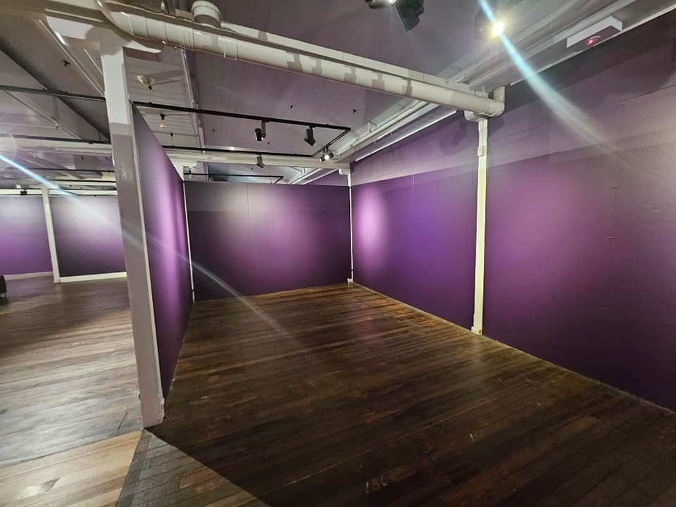 A Bedroom with a Ceiling Fan and a Bed Covered in Paint — Painters Geelong in Geelong, VIC