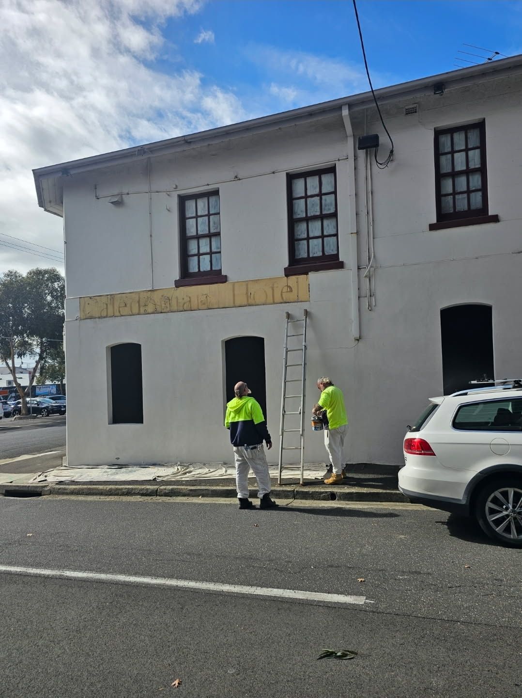 A Bedroom with Blue Walls, a Bed, a Dresser and a Ceiling Fan — Painters Geelong in Geelong, VIC