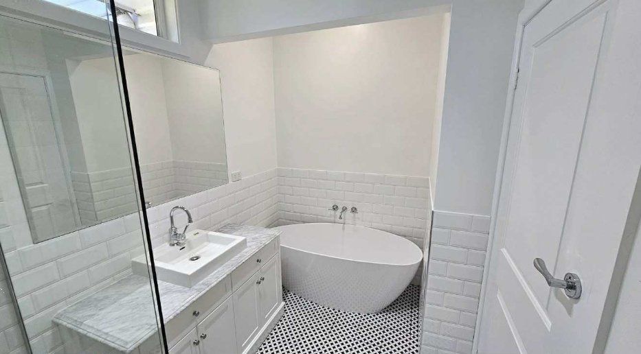 A Garage with a White Wall and a Brick Wall — Painters Geelong in Geelong, VIC