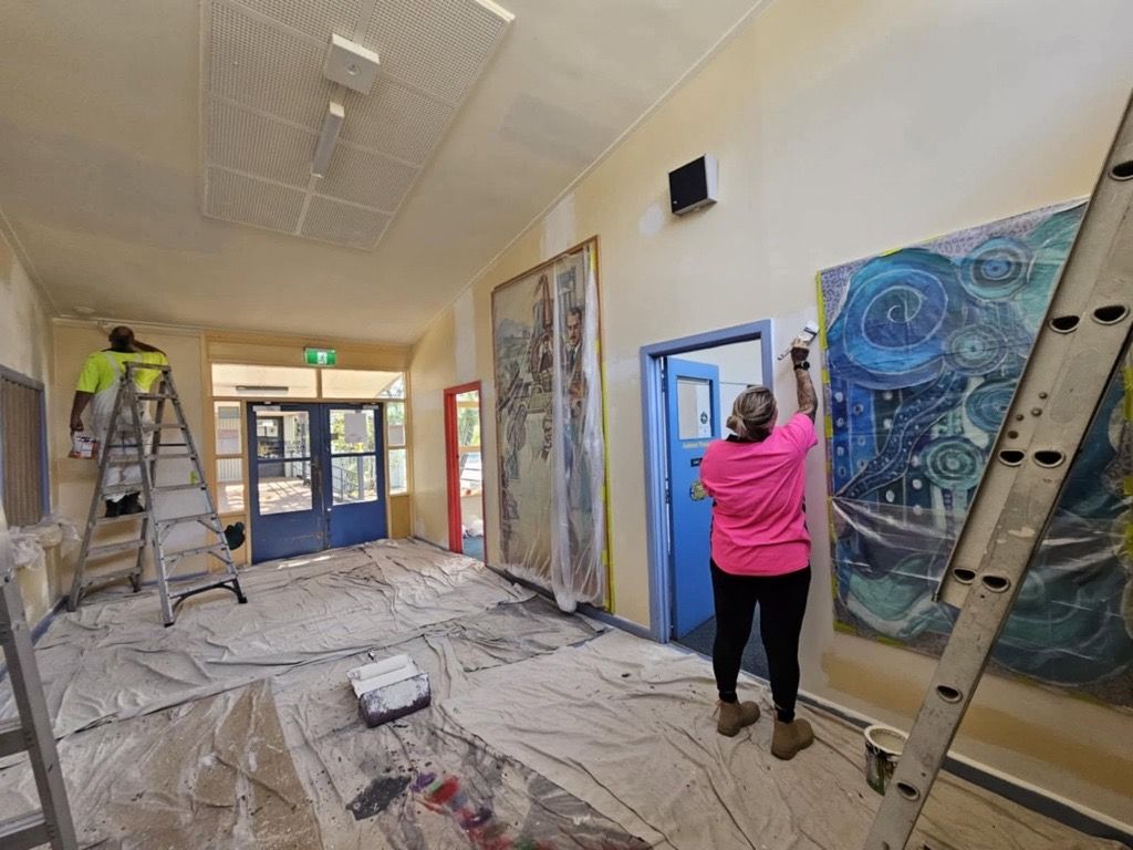 A Living Room with a Couch, Chairs, a Television and a Fireplace — Painters Geelong in Geelong, VIC