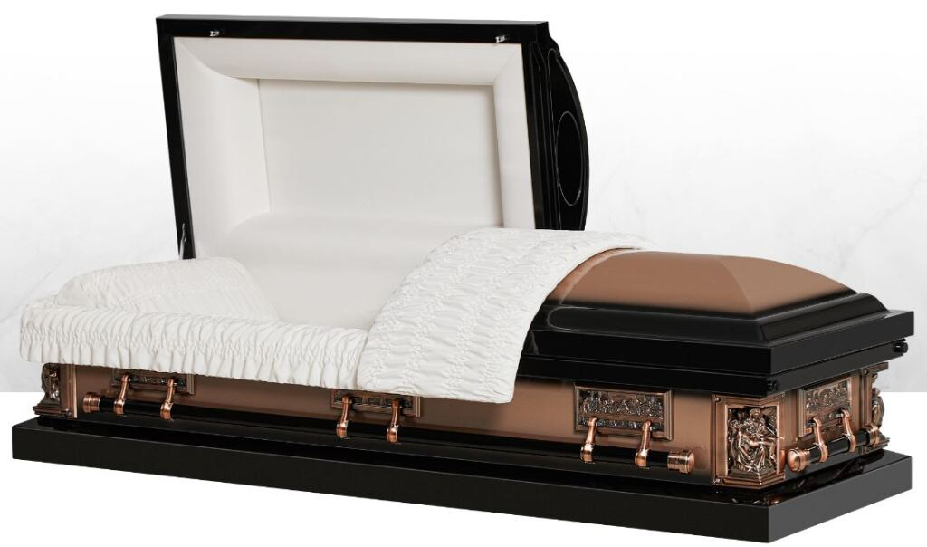Open white casket with white bedding and copper-toned trim on a black base