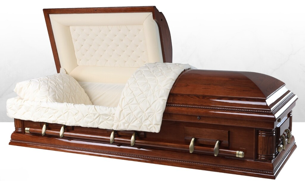 Open wooden casket with white satin lining and closed lid on a plain background