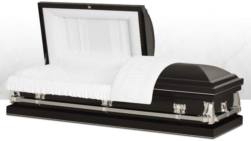Black-and-white open casket with white satin lining and silver handles