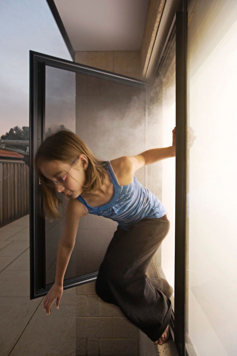 A Girl Leaving A Building With Lots Of Smoke — Clearshield Security Screens in Bomaderry, NSW