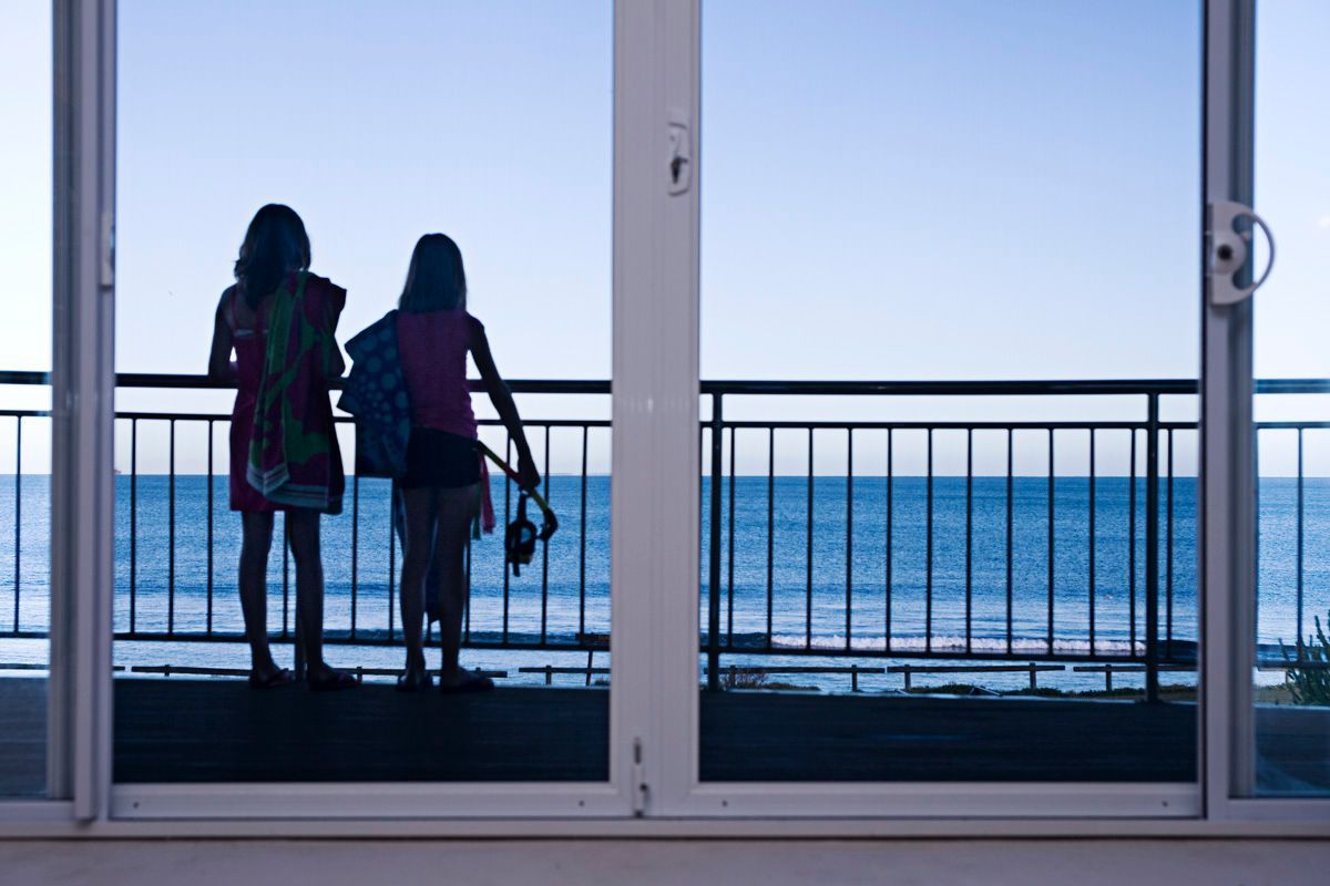Two Young Lady Looking At The Ocean — Clearshield Security Screens in Nowra, NSW