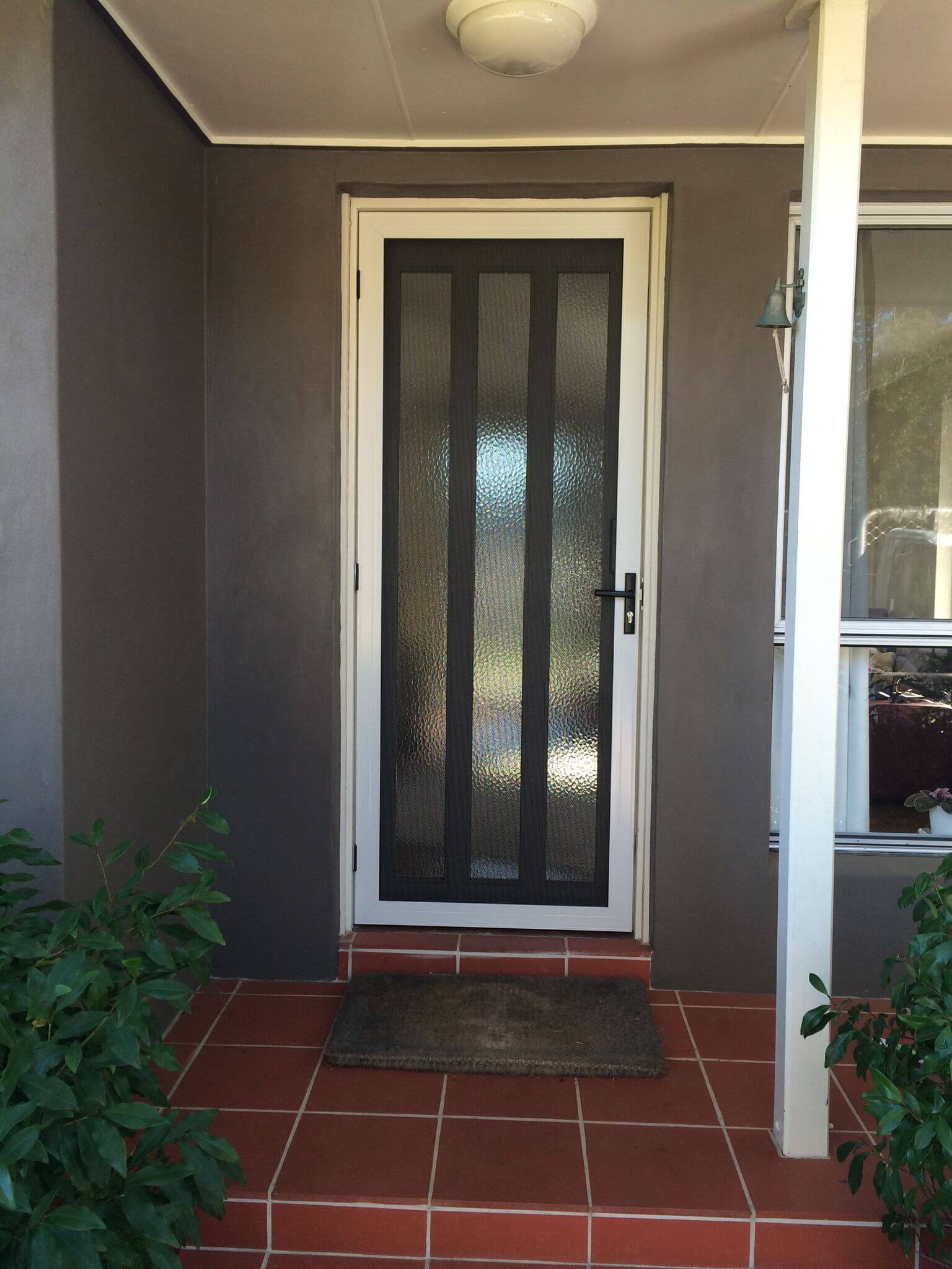 New Installed Door With Security Hinges — Clearshield Security Screens in Bomaderry, NSW