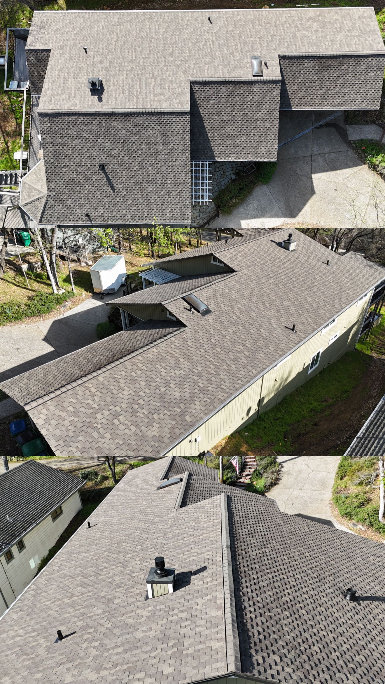 Aerial view of several gray-tiled rooftops and a small courtyard between houses.