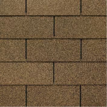 Close-up of brown and tan roof shingles arranged in a staggered pattern